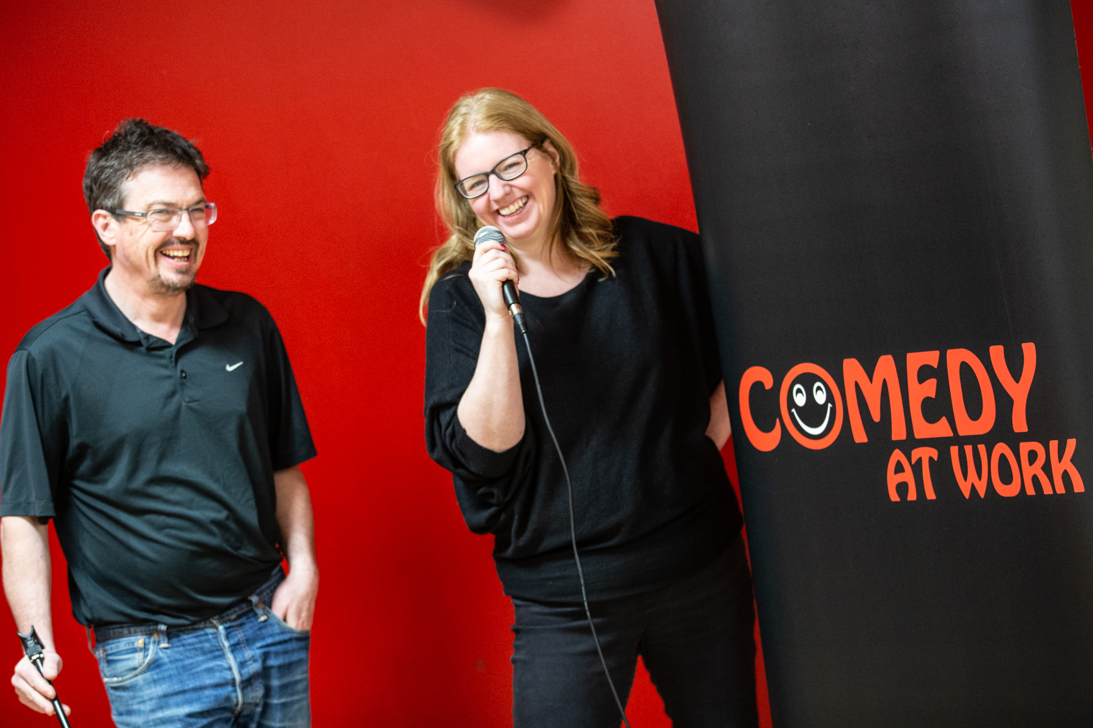 Mark Hinds and Anne Docherty of Comedy at Work laughing together